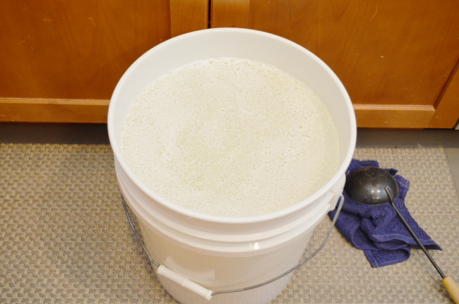 filled bucket of laundry detergent